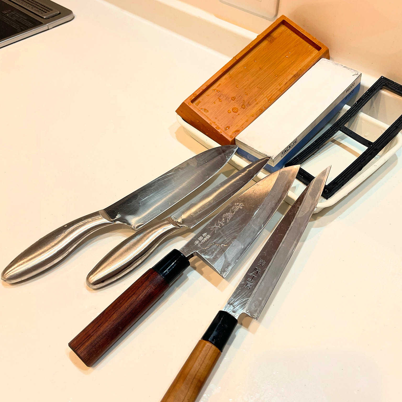 Japanese whetstone set on a kitchen counter for knife sharpening.