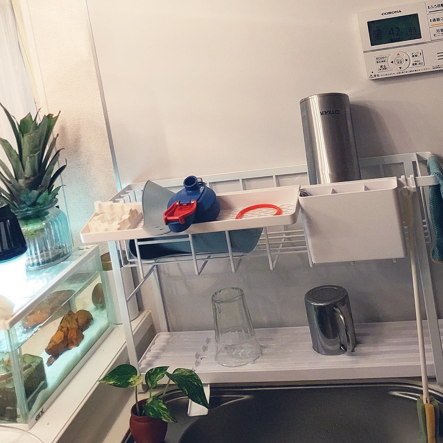 A narrow two-tier Yamazaki Tower dish rack fitted into a slim kitchen space.