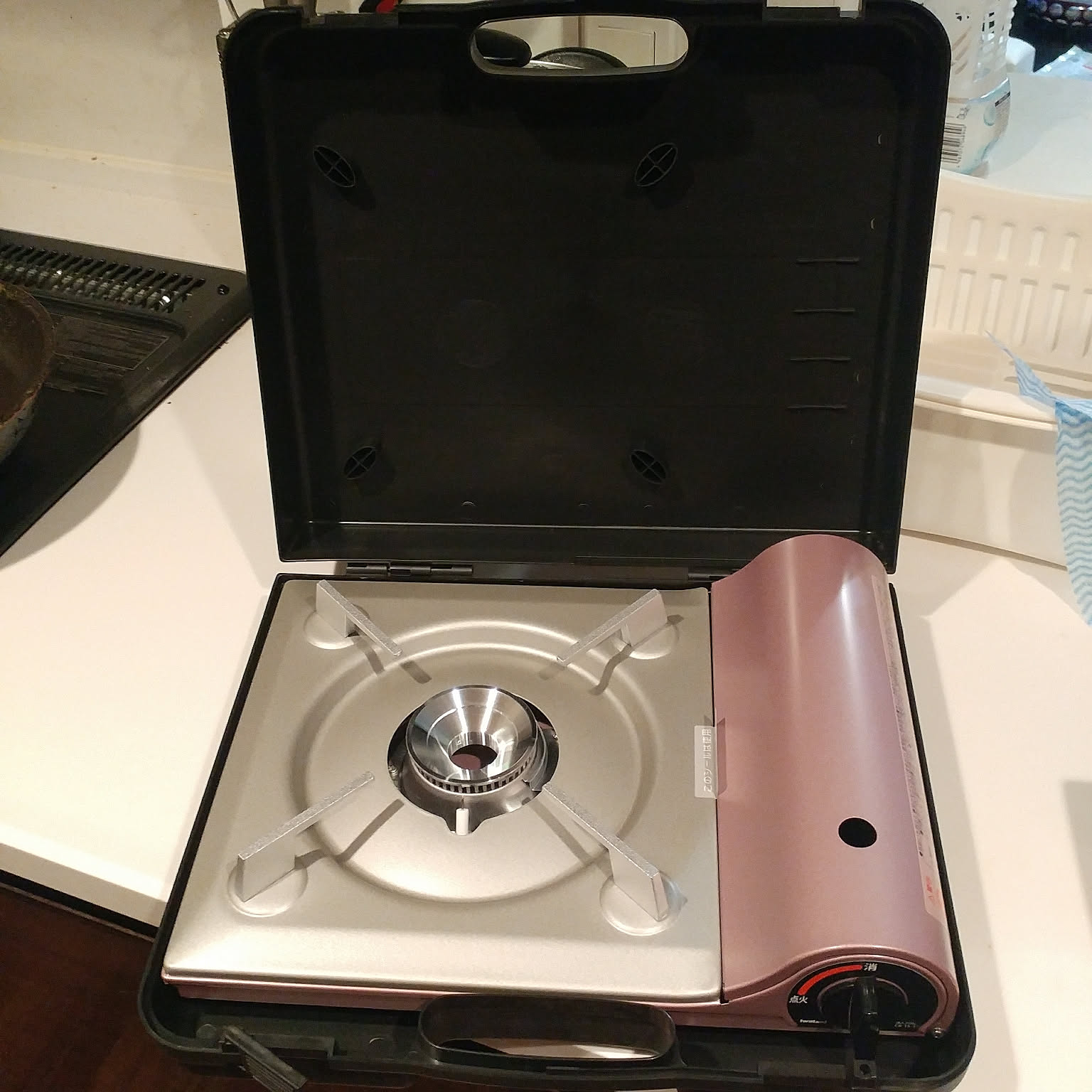 An Iwatani Tatsujin Slim cassette stove shown in its storage case.