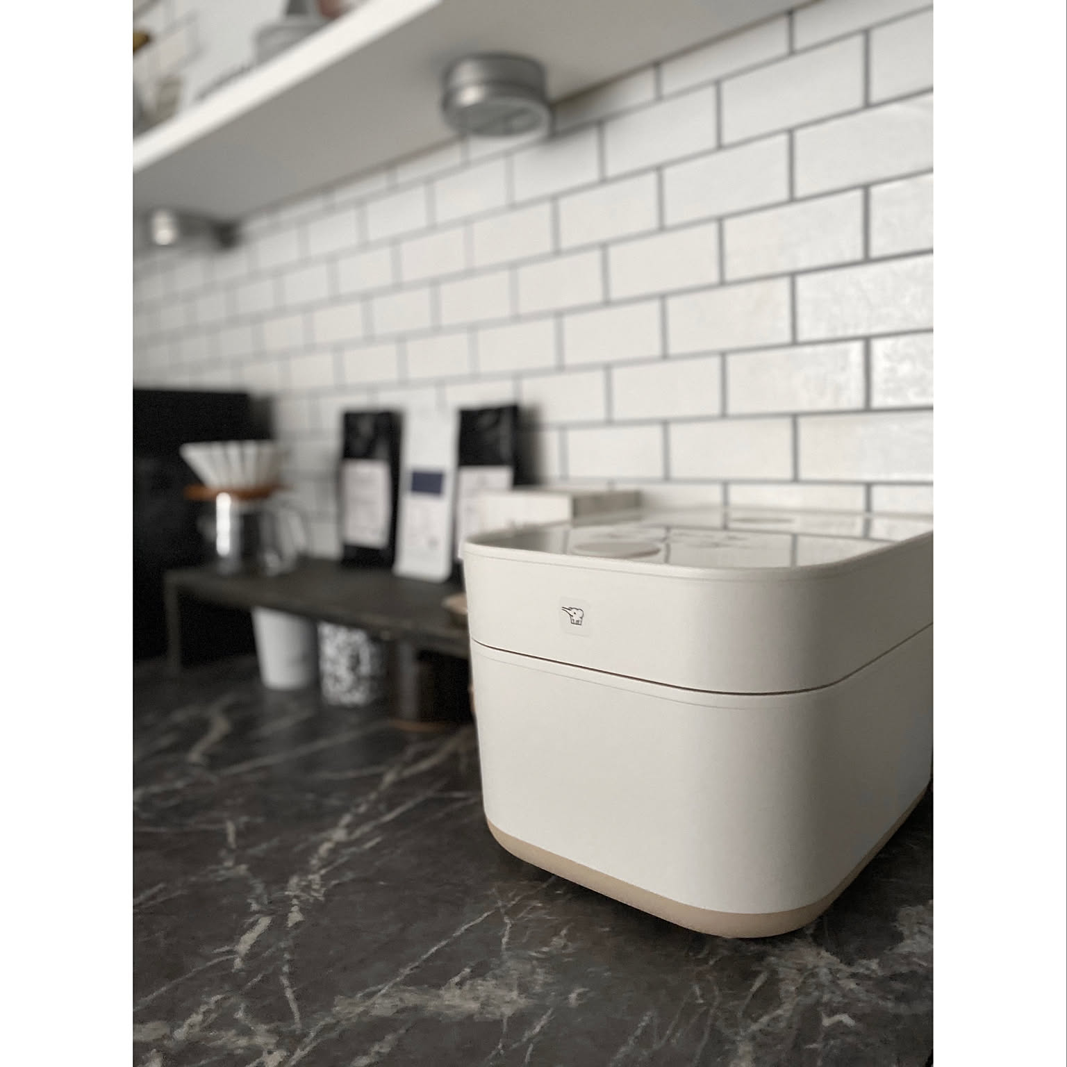 A white Zojirushi STAN. rice cooker integrated into a kitchen appliance corner.