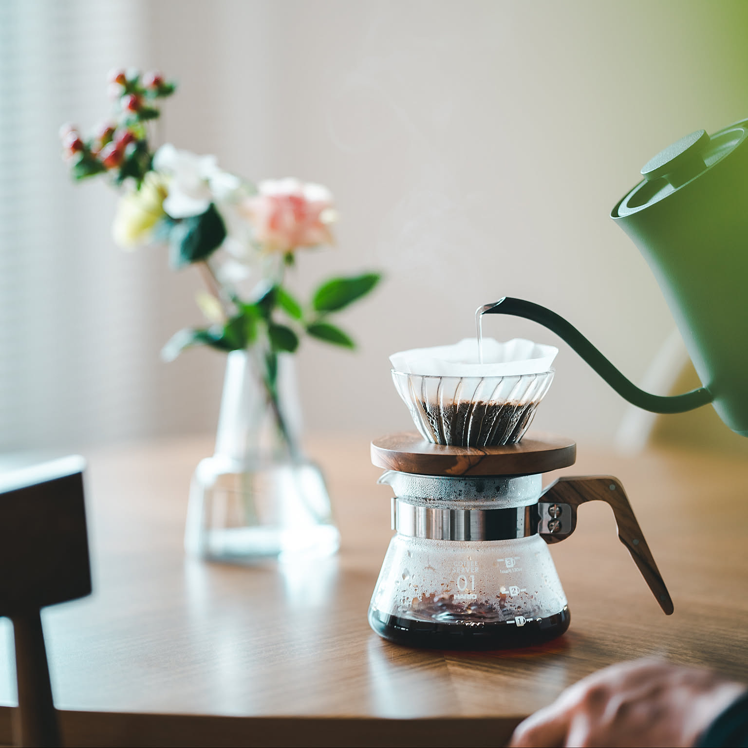 A close product-focused shot of a Hario V60 dripper in a Japanese coffee setup.