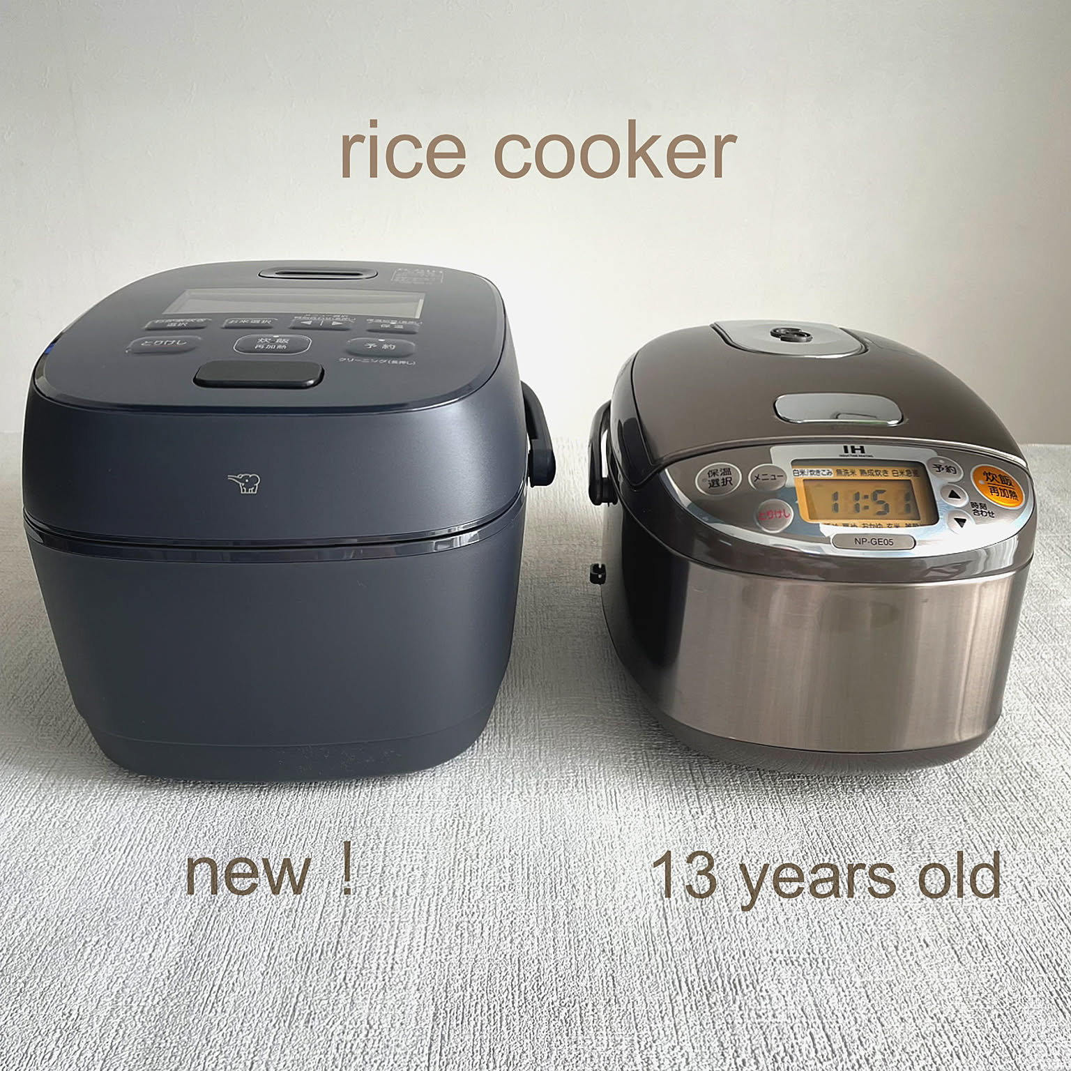 A new Zojirushi rice cooker shown beside an older compact rice cooker for size comparison.