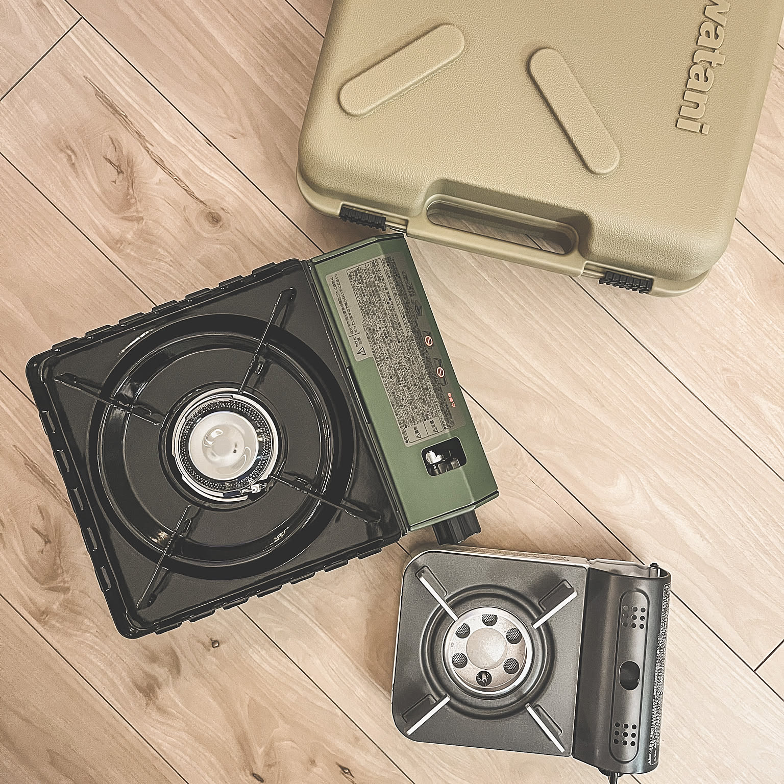 Two Iwatani cassette stoves placed side by side with a Tough Maru case.