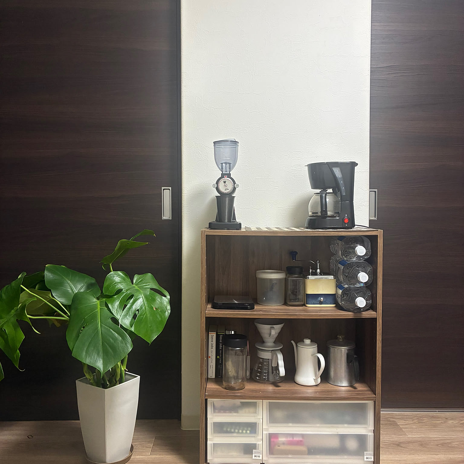 Coffee shelf with HARIO V60 gear, grinder, filters, kettle, and drawer storage.
