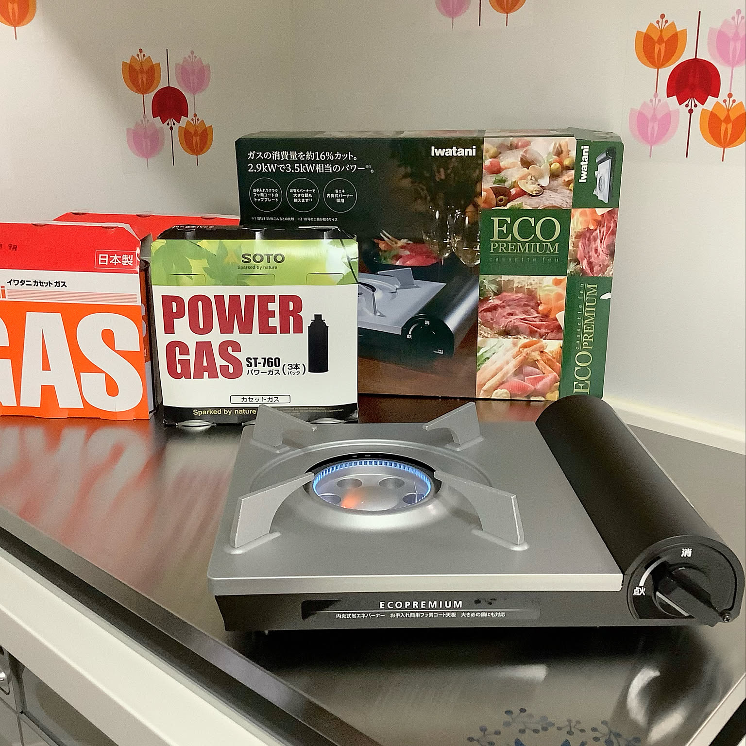 An Iwatani Eco Premium cassette stove shown with butane canisters for preparedness.