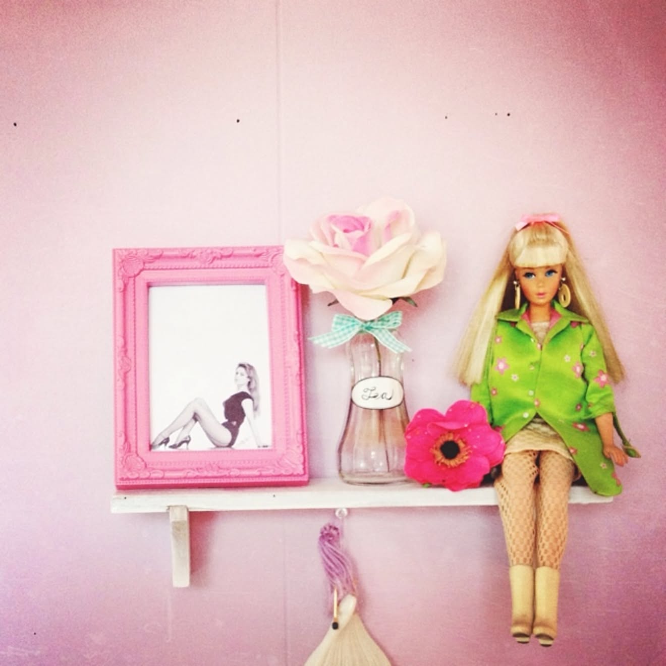 Minimalist vintage Barbie display with flowers